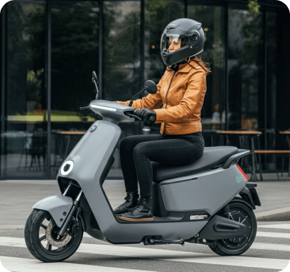 Person on scooter near cafe