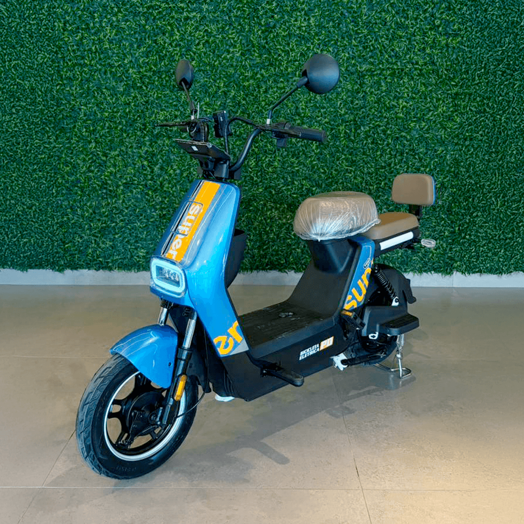 Person on scooter near cafe