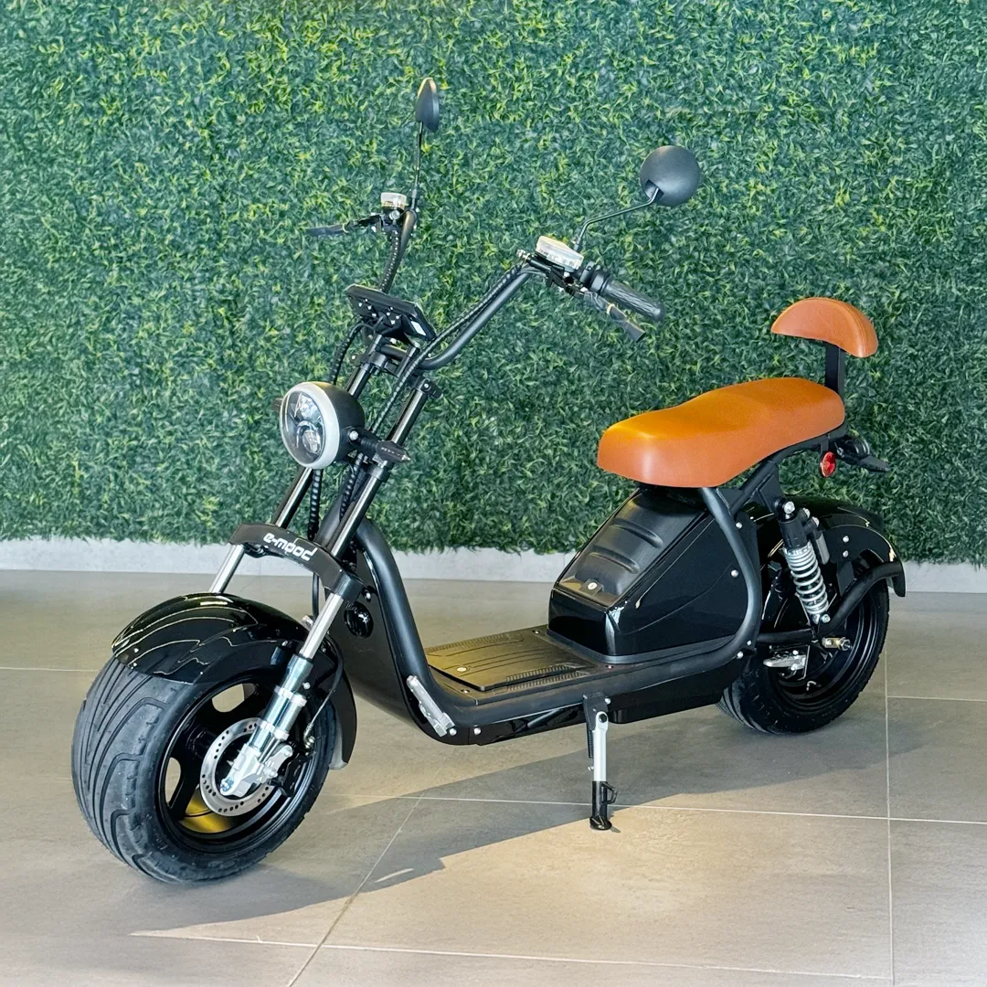 Person on scooter near cafe